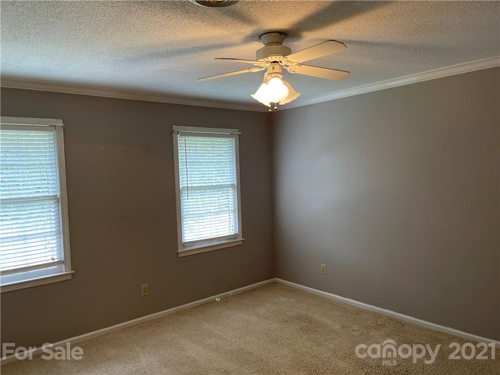 170 Nottingham Road Salisbury, NC 28147 - Photo 21 of 27 an empty room with windows and fan