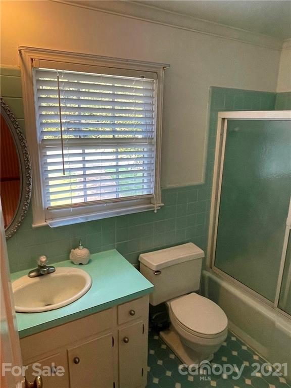 170 Nottingham Road Salisbury, NC 28147 - Photo 24 of 27 a bathroom with a sink toilet and a mirror