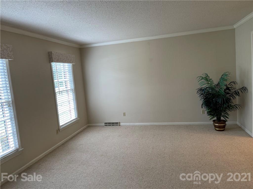 170 Nottingham Road Salisbury, NC 28147 - Photo 4 of 27 an empty room with windows