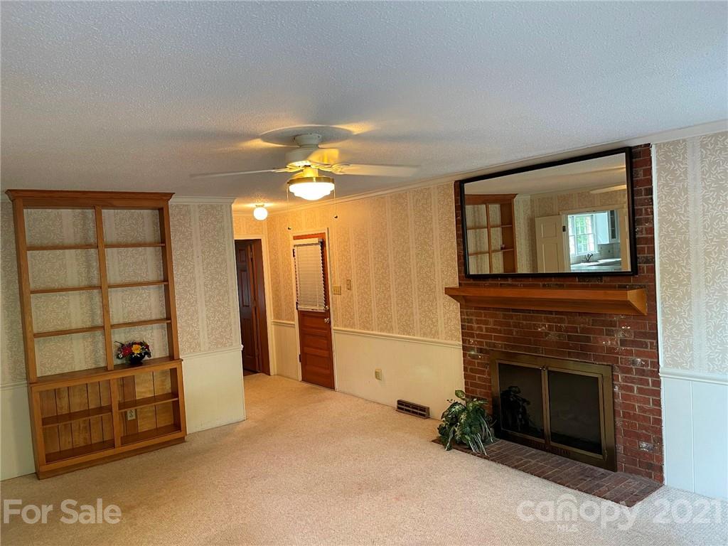 170 Nottingham Road Salisbury, NC 28147 - Photo 7 of 27 a view of a livingroom with an empty space and a fireplace
