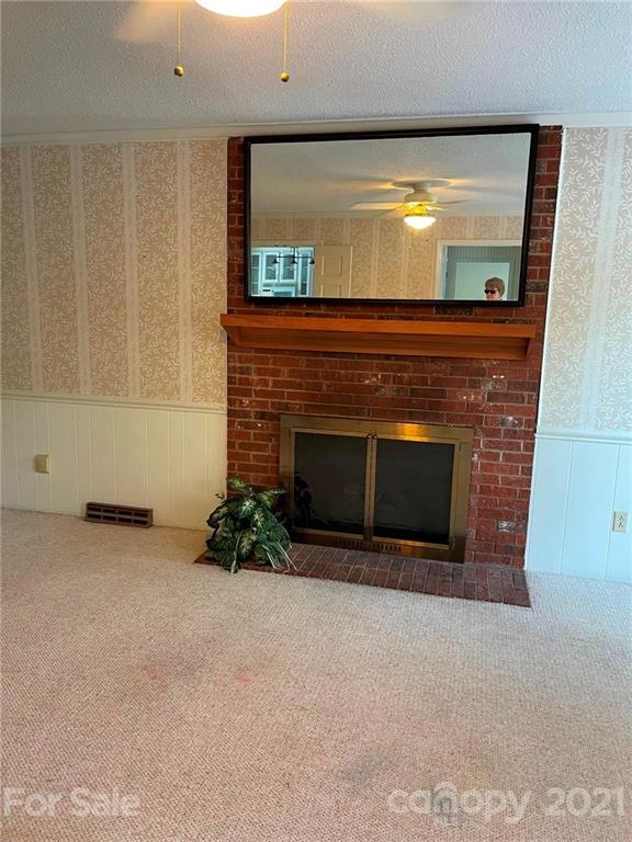 170 Nottingham Road Salisbury, NC 28147 - Photo 8 of 27 a living room with a fireplace