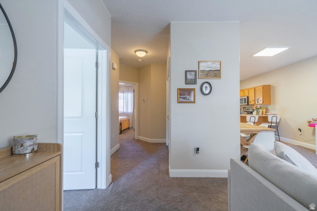 700 North Main Street, Unit F3 Washington, UT 84780 - Photo 2 of 34 Hallway with light gray walls, carpeted flooring, and white trim