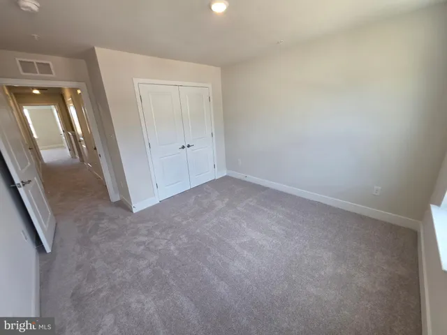 an empty room with a mirror