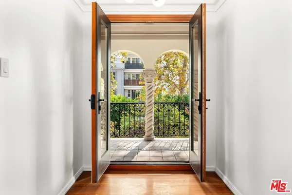 a view of a porch with a floor to ceiling window