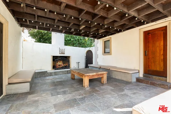 a front view of a house with a garden and yard