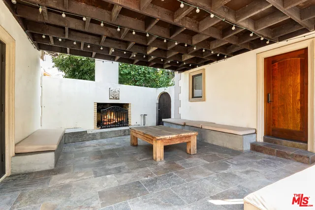 a front view of a house with a garden and yard