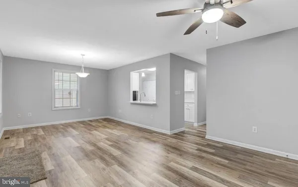 a view of an empty room with a window