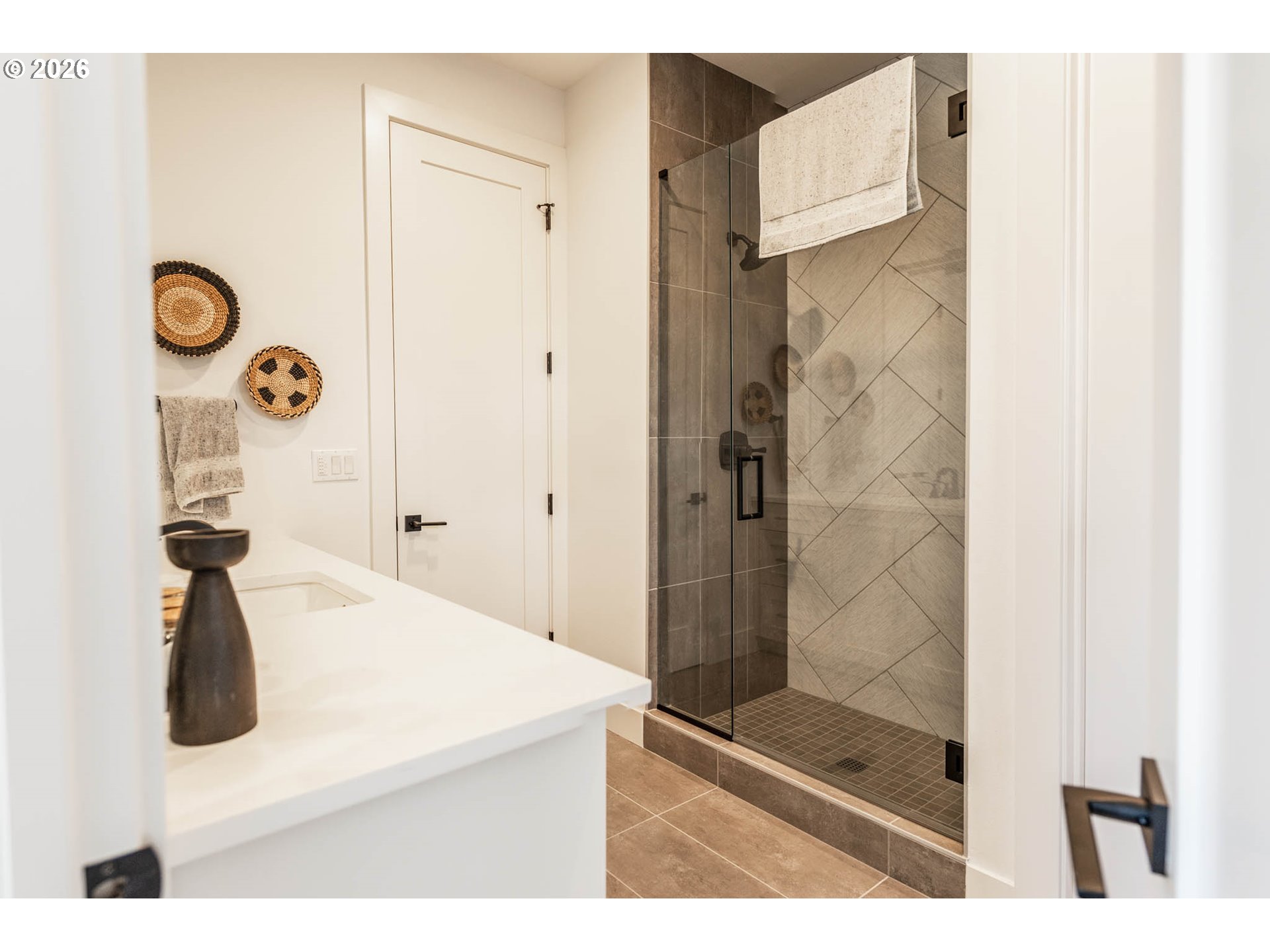 4560 Southwest 59th Avenue Portland, OR 97221 - Photo 16 of 30 a bathroom with a sink a mirror and shower