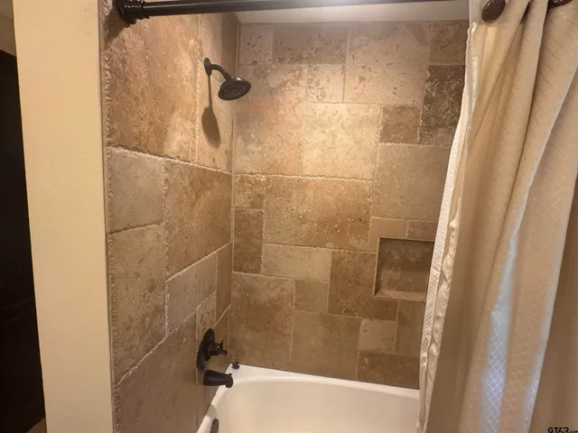 a bathroom with a bathtub