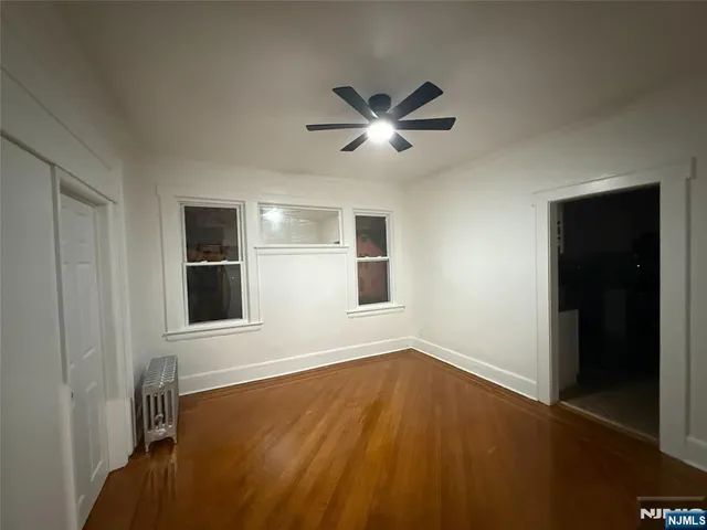 wooden floor and window in an empty room