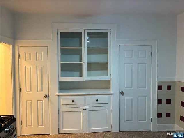 a kitchen with stainless steel appliances a refrigerator and a stove top oven