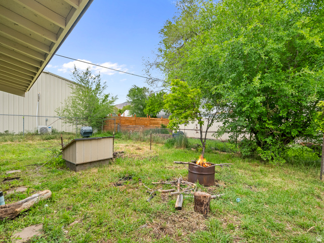 510 Canyon Road Ogden, UT 84404 - Photo 26 of 30 View of yard with a fire pit