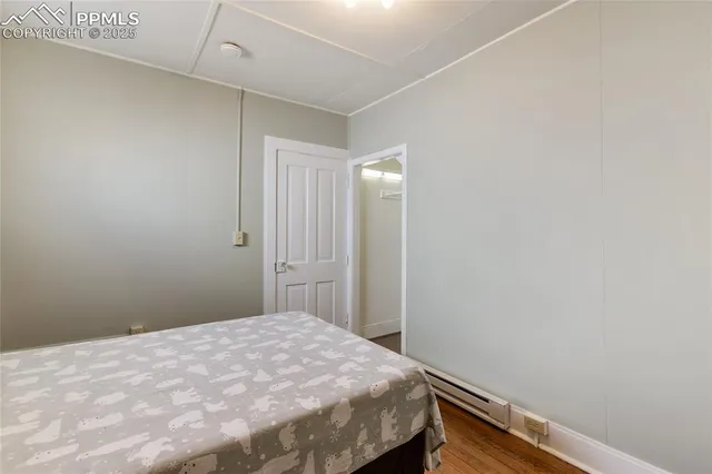 a bedroom with a bed and a table