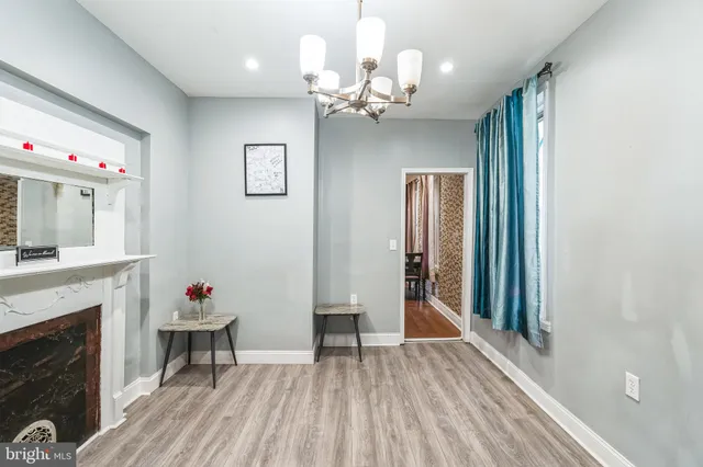 a view of a livingroom with kitchen and furniture