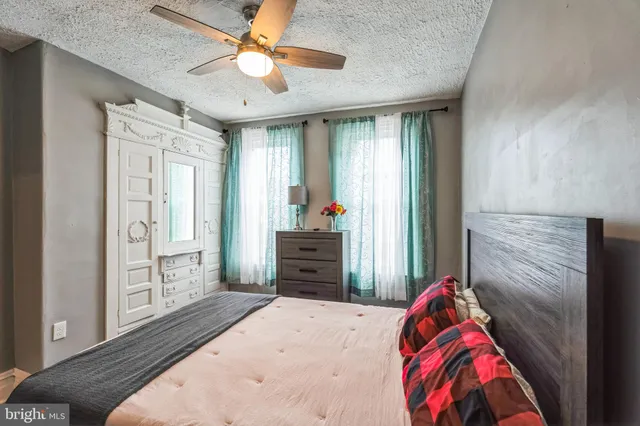 a room with a bed and a flat screen tv