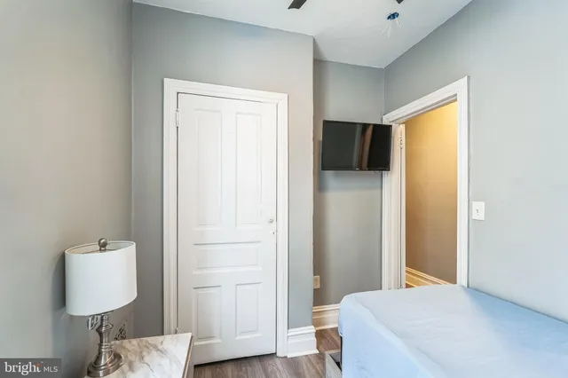 a bedroom with a bed and a window