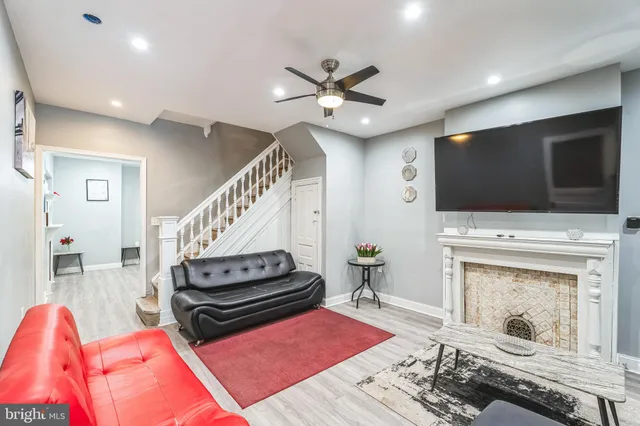 a bedroom with furniture and a chandelier