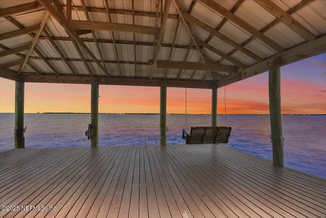 a view of a balcony with wooden floor