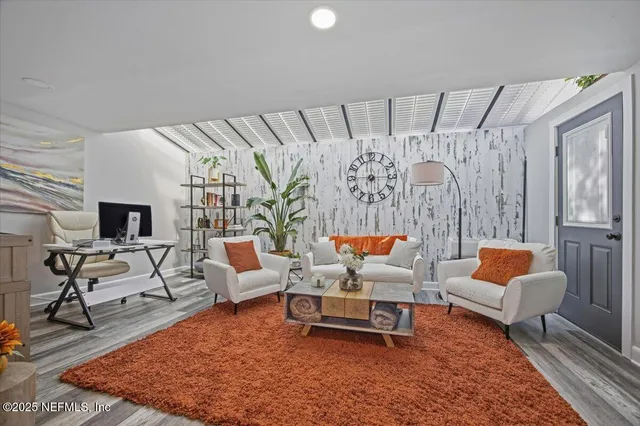 a living room with furniture and a rug