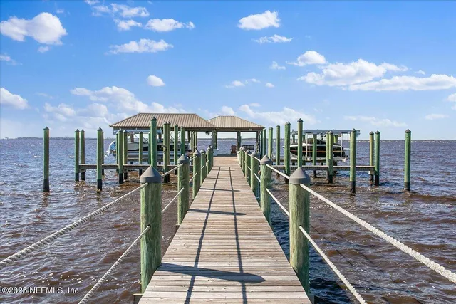 a view of a balcony with wooden floor and city view