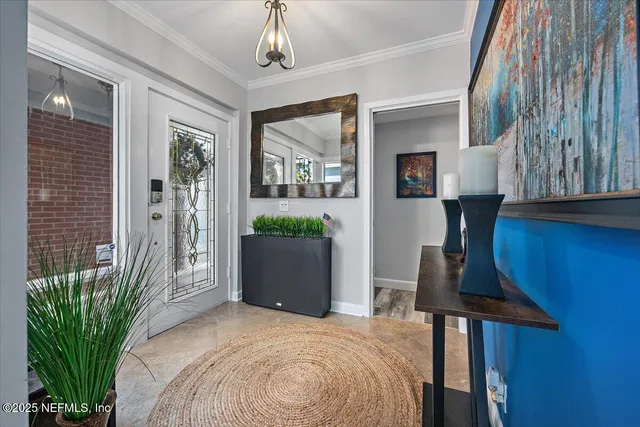 a bedroom with a bed and a potted plant