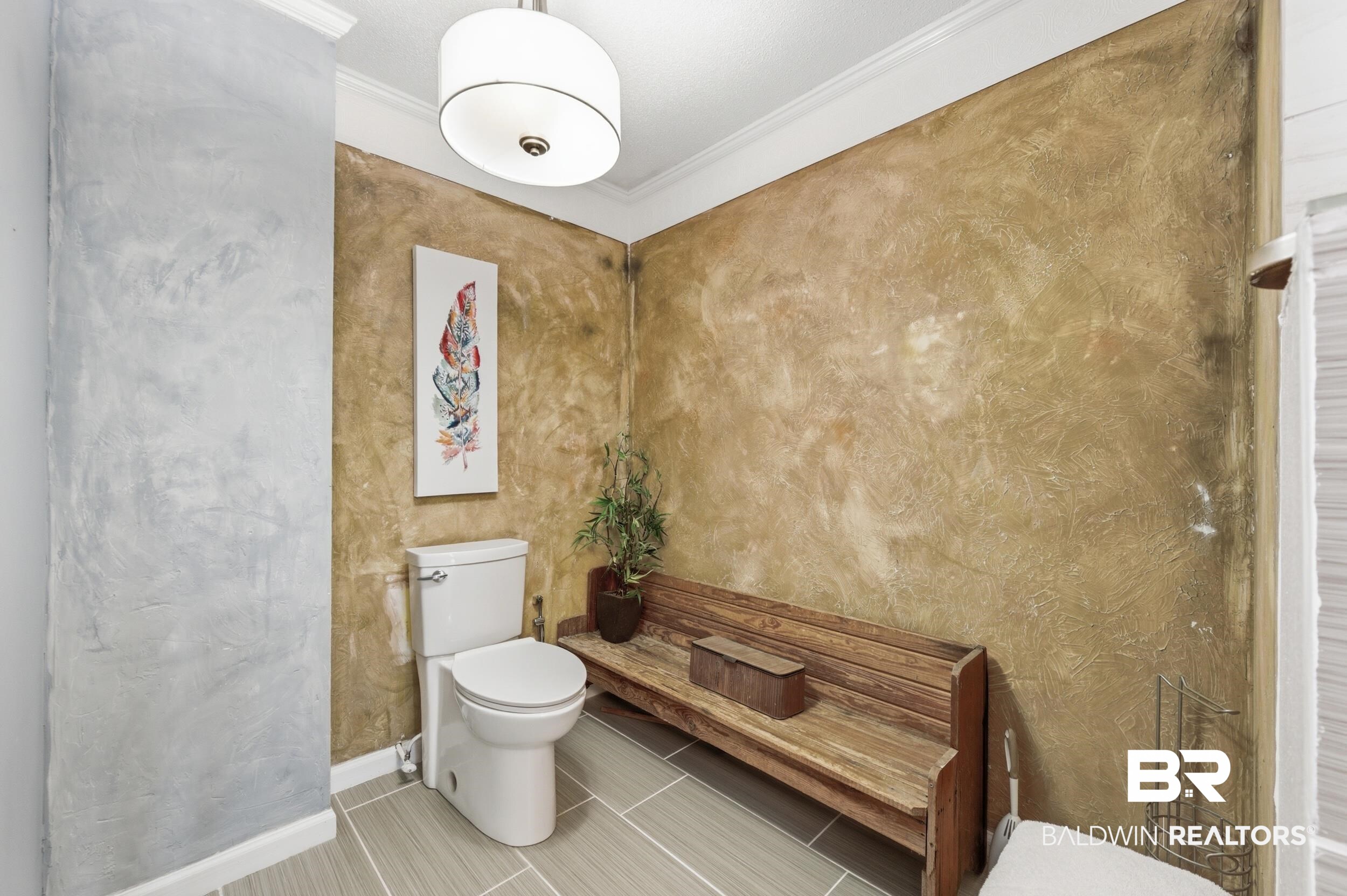 51620 Robert White Road Bay Minette, AL 36507 - Photo 45 of 81 Bathroom featuring a white toilet, light gray tile flooring, and textured wall finishes
