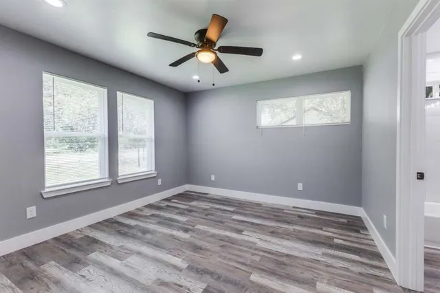 a view of room with window and ceiling fan