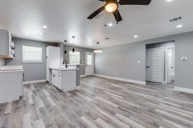 a view of a kitchen with a sink cabinets and window