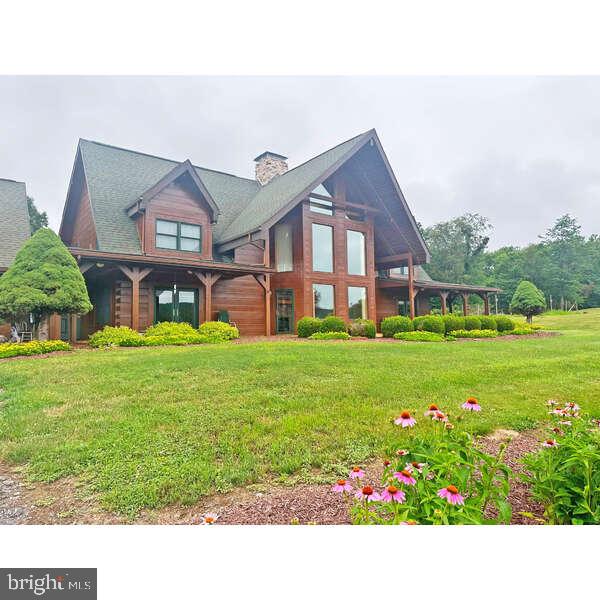 Charming lodge amidst lush greenery.
