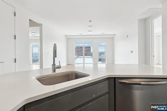 a kitchen with a sink and cabinets