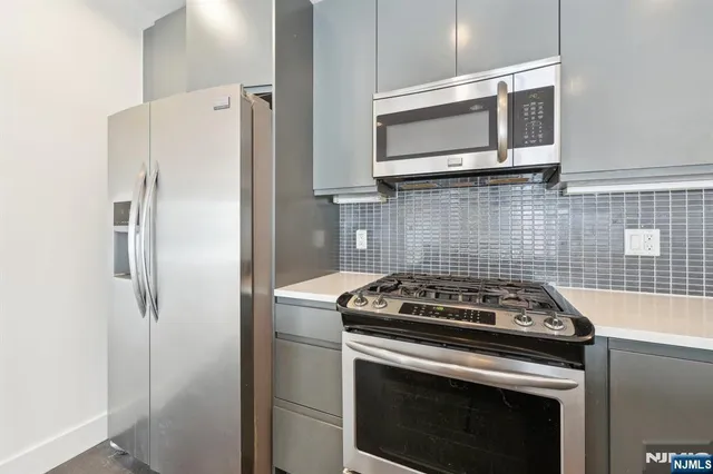 a kitchen with a stove and a microwave