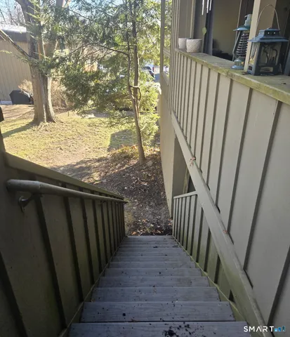 a view of stairs and wooden floor