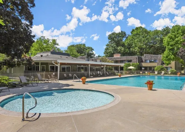 a view of a house with outdoor space and sitting area