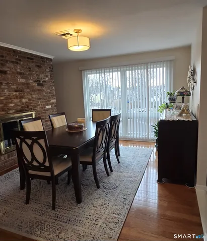 a view of a dining room with furniture and window
