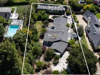 an aerial view of house with a yard