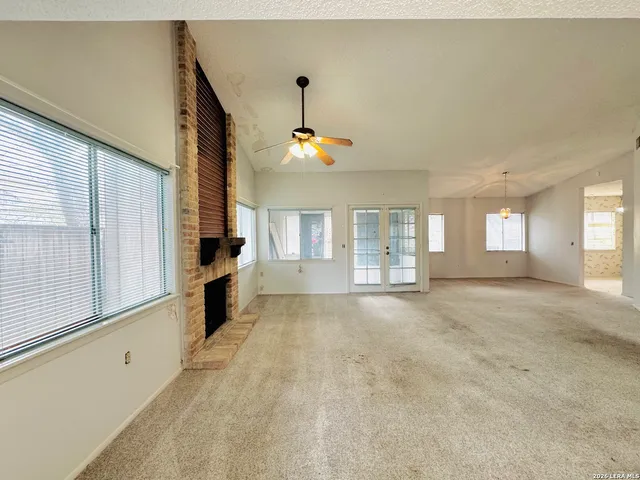 a view of a kitchen with a sink and a window