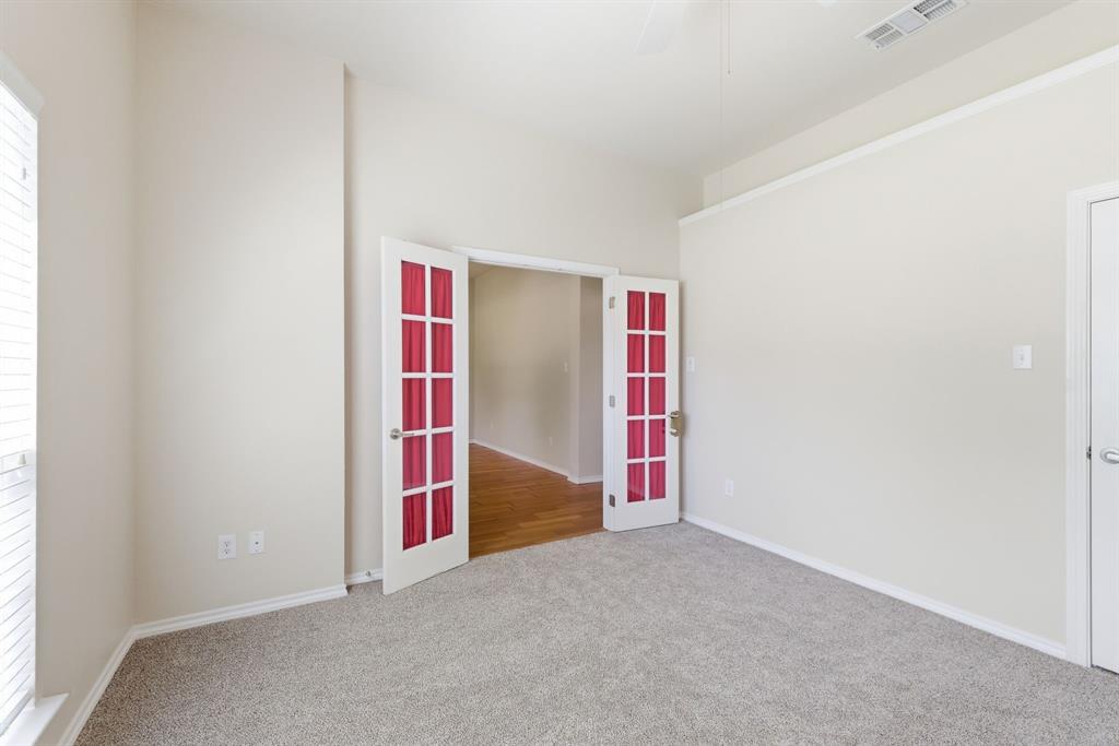 817 Huebner Way Burleson, TX 76028 - Photo 11 of 35 This is another view of the office or bedroom. This shows the French doors that can be closed to ensure privacy.