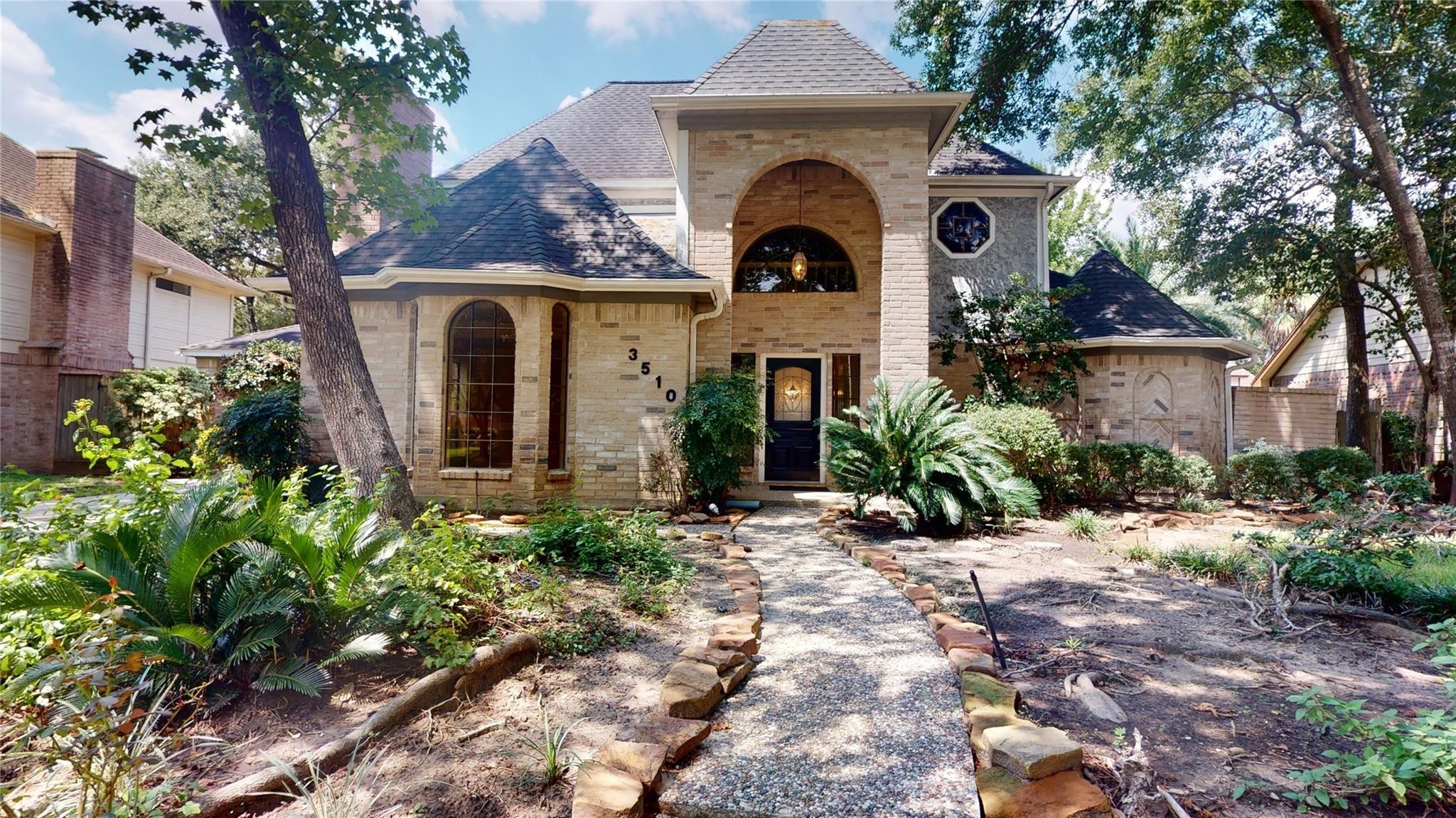 3510 Cypresswood Drive Spring, TX 77388 - Photo 1 of 36 a front view of a house with garden