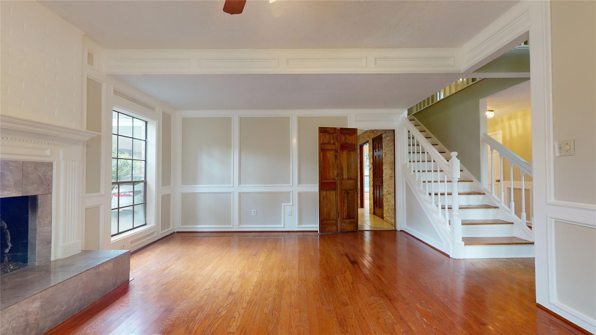 3510 Cypresswood Drive Spring, TX 77388 - Photo 11 of 36 wooden floor in an empty room with a window