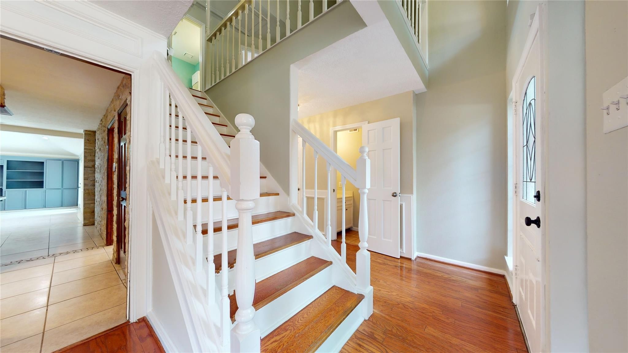 3510 Cypresswood Drive Spring, TX 77388 - Photo 13 of 36 a view of entryway with stairs and wooden floor