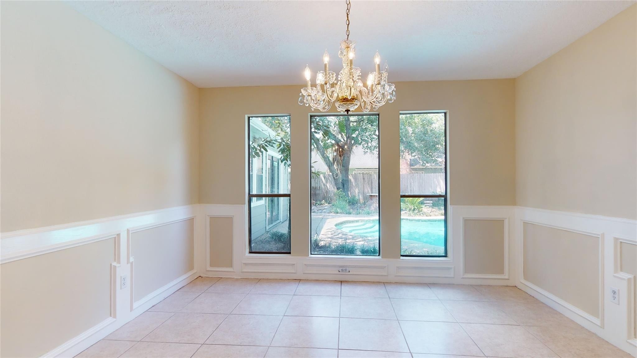 3510 Cypresswood Drive Spring, TX 77388 - Photo 16 of 36 a view of a big room with windows and chandelier