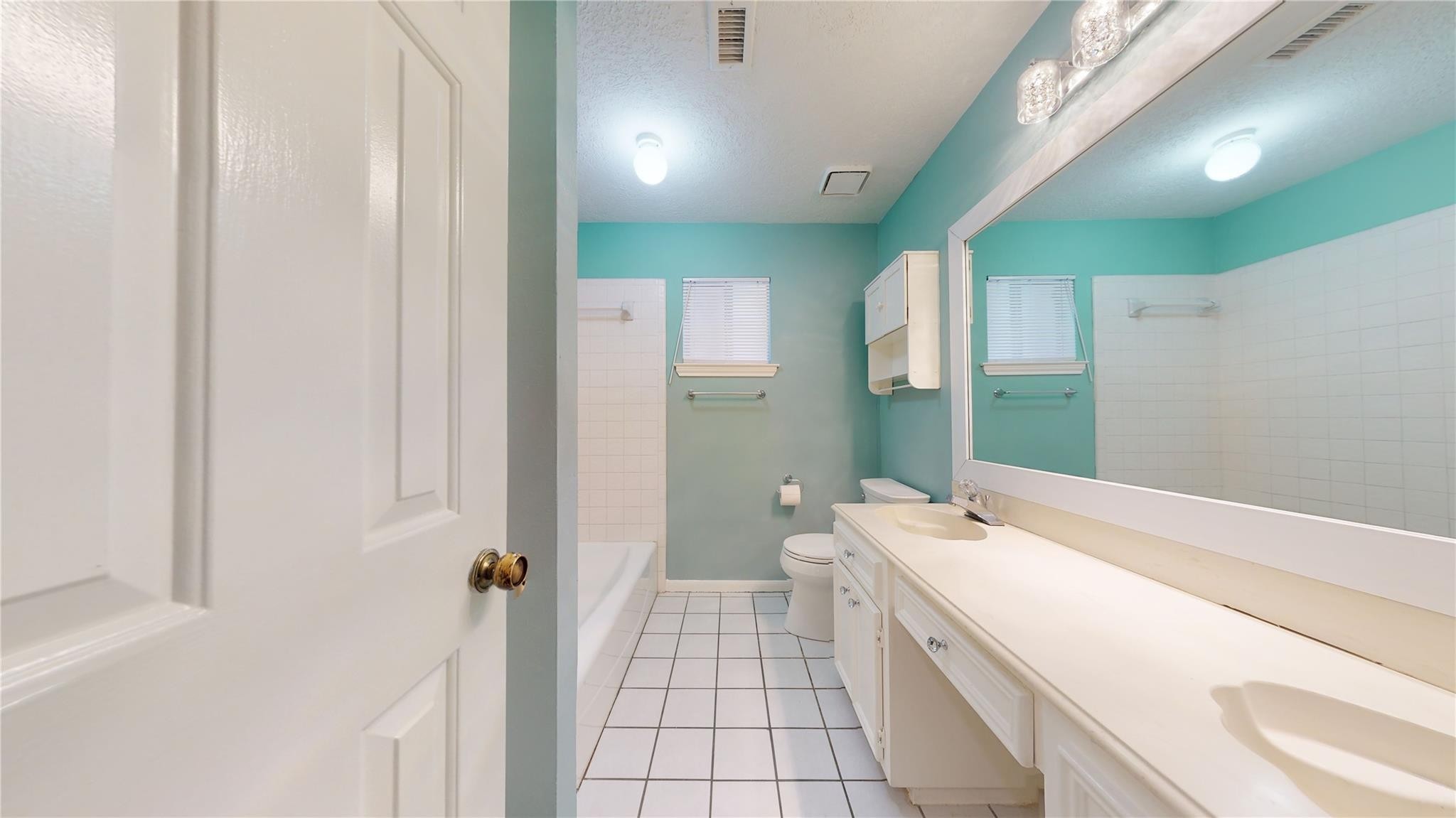 3510 Cypresswood Drive Spring, TX 77388 - Photo 20 of 36 a bathroom with a sink a toilet and shower