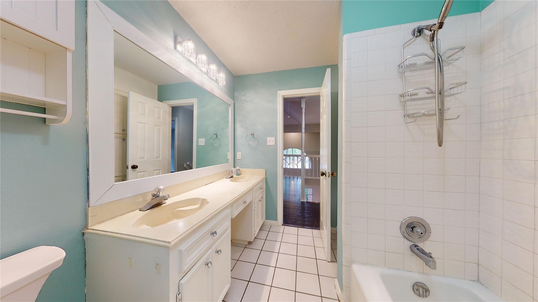 3510 Cypresswood Drive Spring, TX 77388 - Photo 21 of 36 a bathroom with a sink a toilet and shower