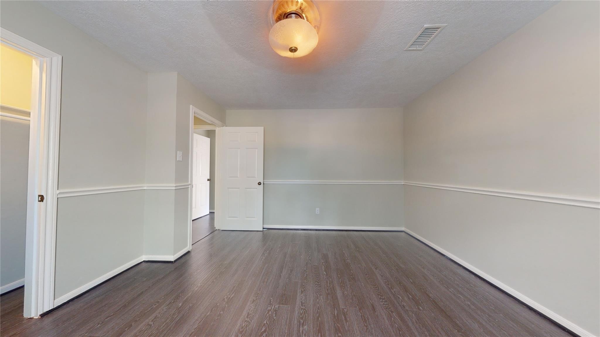 3510 Cypresswood Drive Spring, TX 77388 - Photo 23 of 36 a view of a room with wooden floor and window