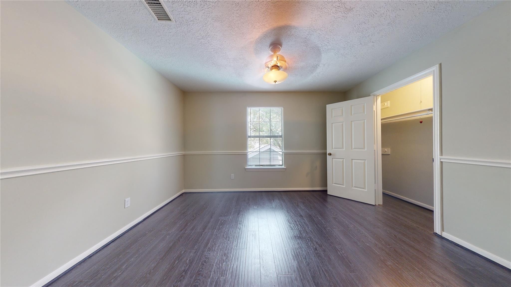3510 Cypresswood Drive Spring, TX 77388 - Photo 25 of 36 an empty room with wooden floor and windows