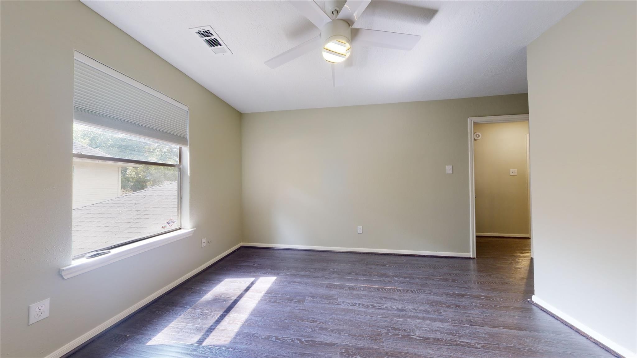 3510 Cypresswood Drive Spring, TX 77388 - Photo 26 of 36 wooden floor in an empty room with a window