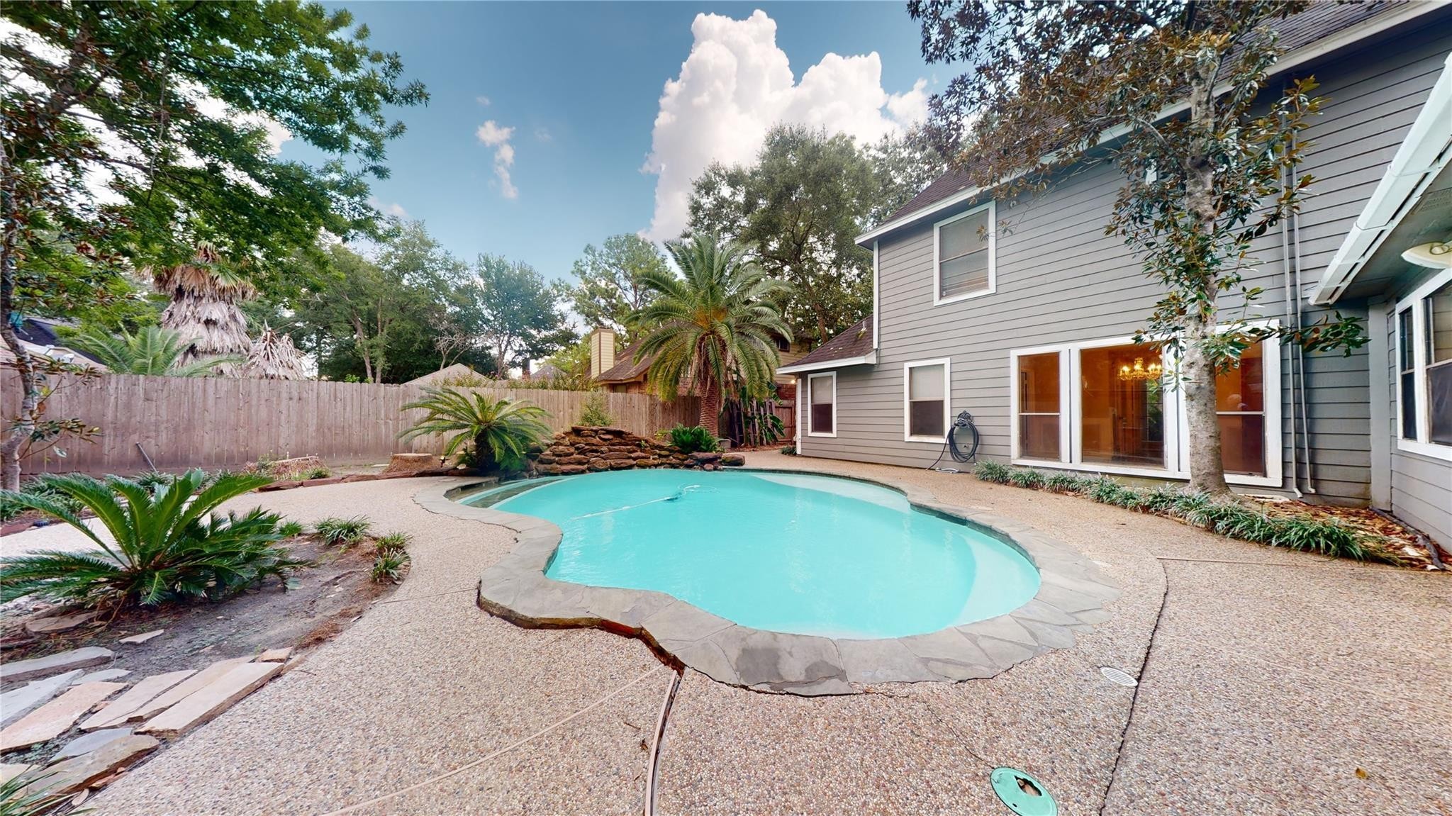 3510 Cypresswood Drive Spring, TX 77388 - Photo 31 of 36 a view of a house with backyard sitting area and swimming pool