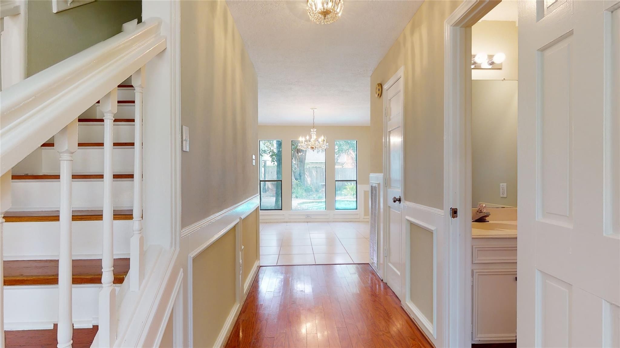 3510 Cypresswood Drive Spring, TX 77388 - Photo 5 of 36 a view of a hallway with wooden floor and windows