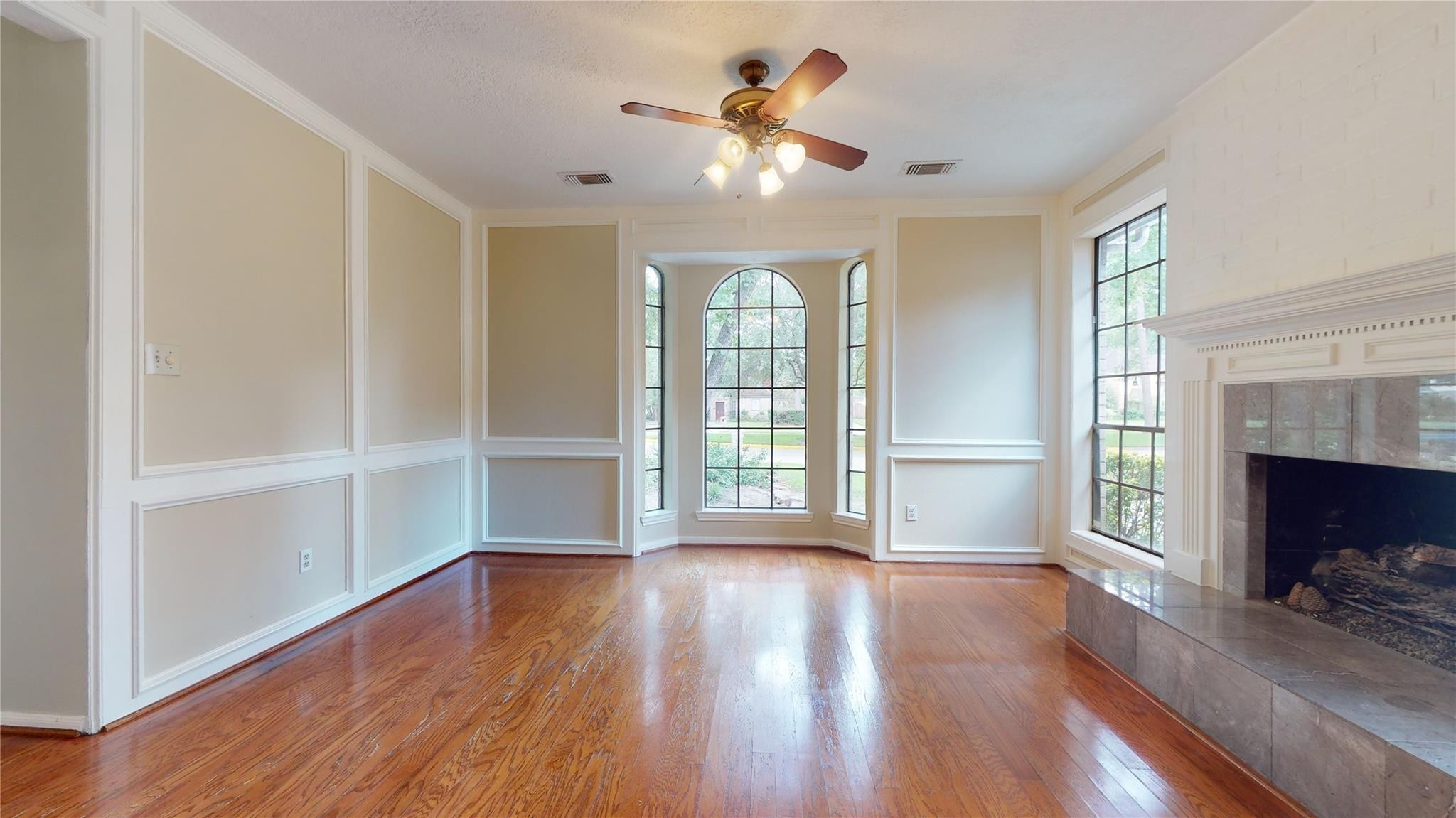 3510 Cypresswood Drive Spring, TX 77388 - Photo 10 of 36 a view of an empty room with wooden floor and a window