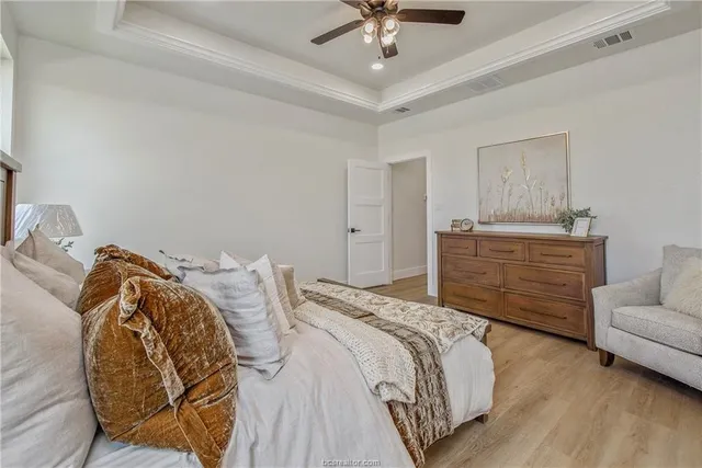 a bedroom with a bed and a couch